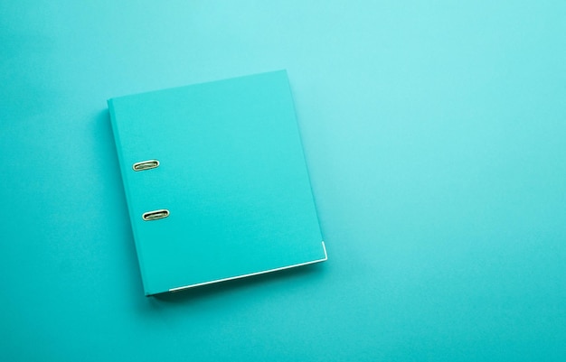 Hardcover folder on blue background