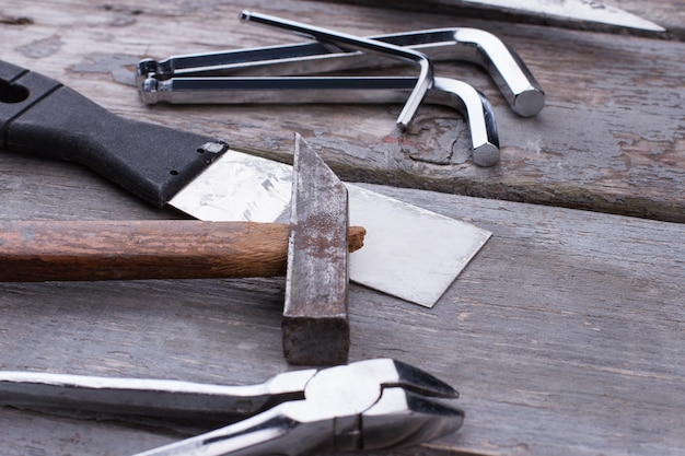 Hardware tools and instruments on wooden background