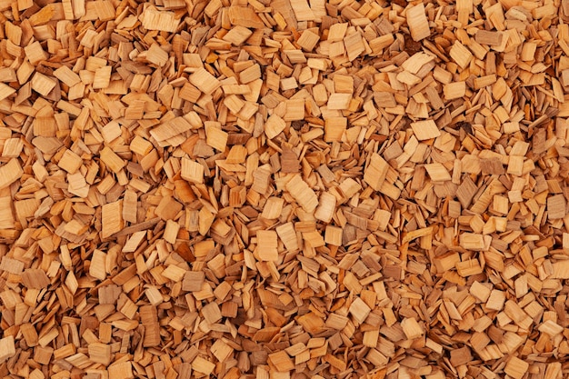 Hardwood alder chips for food smoking closeup Design element copy space.