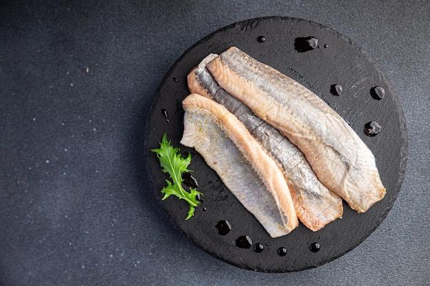 haring gezouten visfilet verse zeevruchten gezonde maaltijd voedsel snack op tafel kopie ruimte voedsel