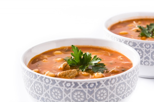 Harira soup in bowl isolated on white typical moroccan food.