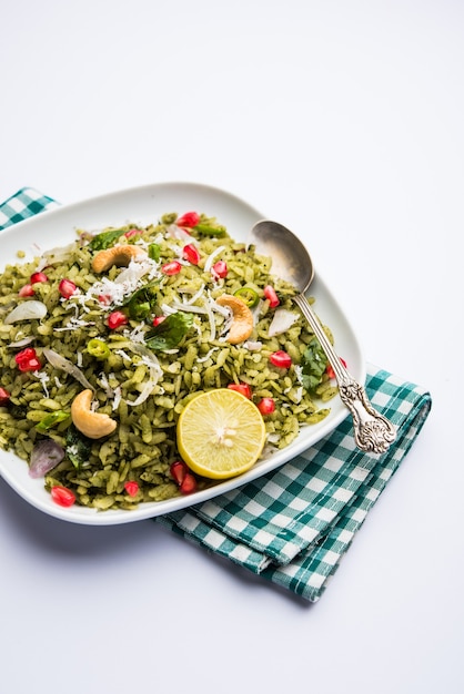Hariyali Poha, Green Masala Pohe or flattened rice served in a bowl, selective focus