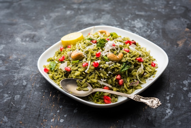 Hariyali Poha, Green Masala Pohe or flattened rice served in a bowl, selective focus