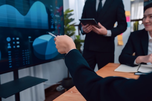 Photo harmony group businesspeople raising hand in meeting room during presentation