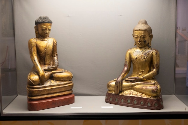 Hartlepool, U.K - July 27, 2021: The National Museum of The Royal Navy, in the North of England. Wooden golden Budha statue.