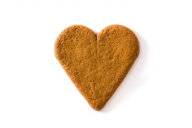 Hartvormig koekje dat op het concept van de Dag en het Moederdag van witte achtergrondvalentine wordt geïsoleerd.