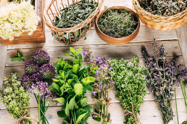 Harvest of medicinal plants healing spicy herbs on a white wooden background alternative medicine ayurveda