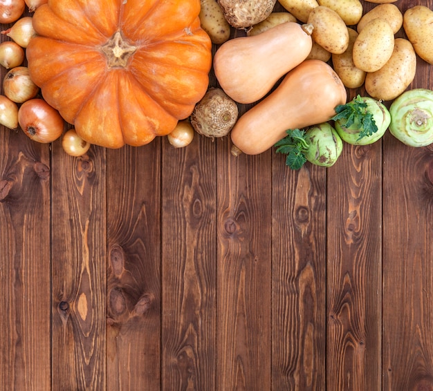 Harvest on wooden table, top view