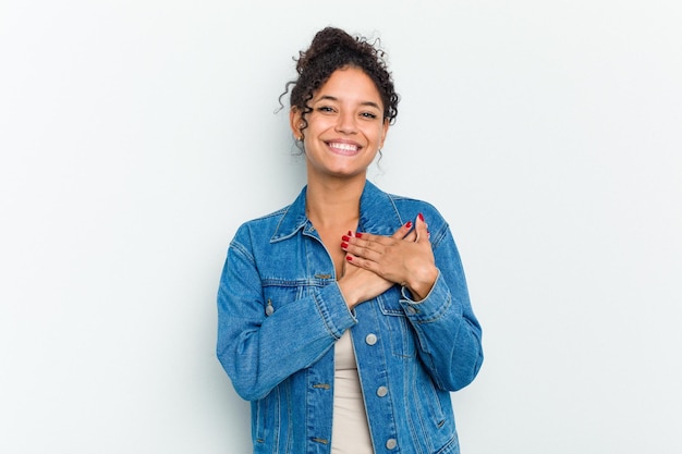 Photo has friendly expression pressing palm to chest love concept