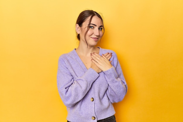 has friendly expression pressing palm to chest love concept