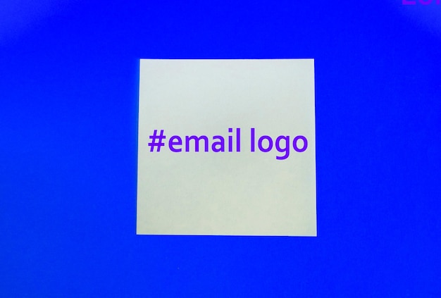 At and hashtag symbols crafted in wood and photographed on a dark stone textured surface