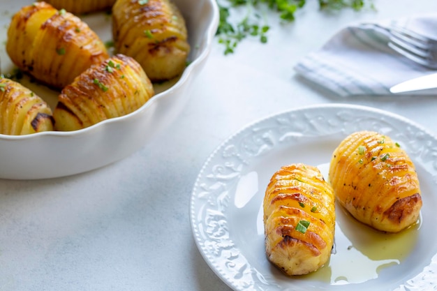 Hasselback potatoes with additional herbs and spices In Turkey fan potatoes are known as baked sliced potatoes Turkish name firinda patates yelpaze patates