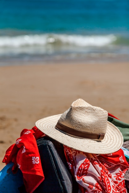 Hat and scarf on the beach