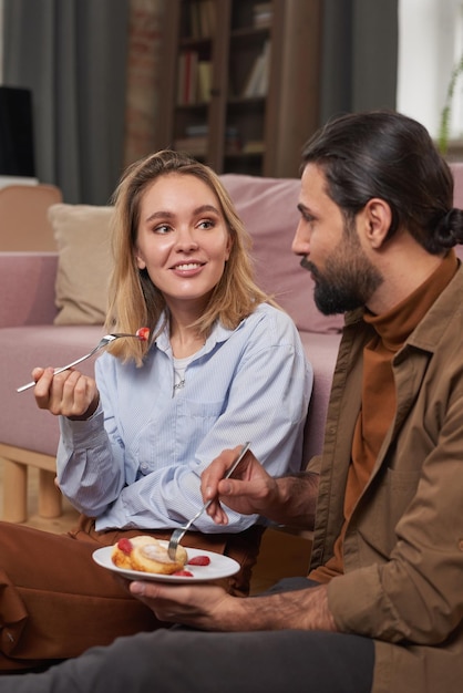 Having Breakfast In Living Room