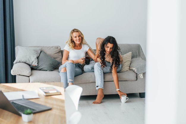having conversation two women is together at home