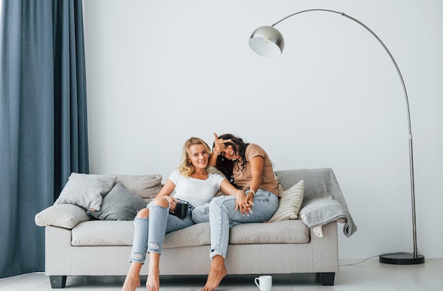 Having conversation Two women is together at home