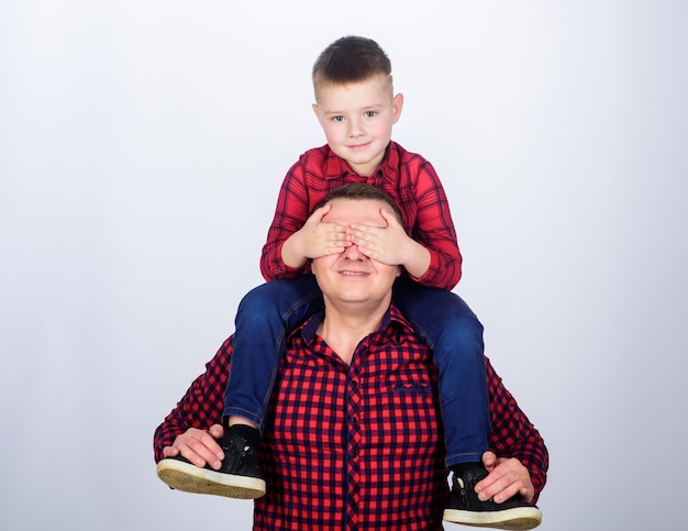 Having fun Happiness being father of boy Fathers day Father example of noble human Best friends forever Father little son red shirts family look outfit Dad piggybacking adorable child