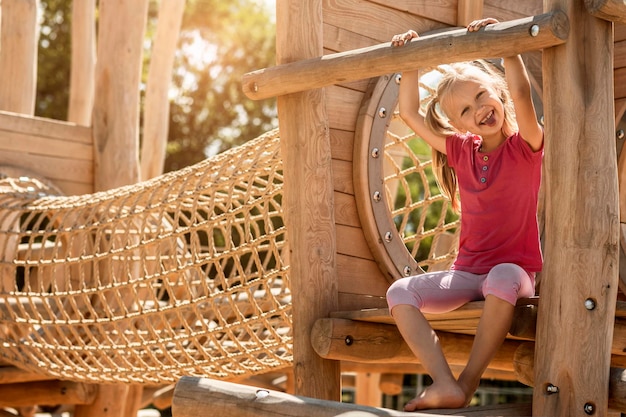 Having fun Playing on Playground Funny Child Climbing on Playground Outdoor Active Happy Holidays