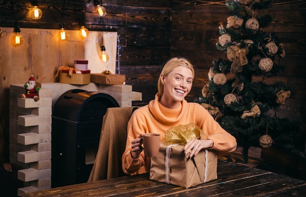 Having fun true emotions positive human emotions facial expressions cute young woman with santa hat ...