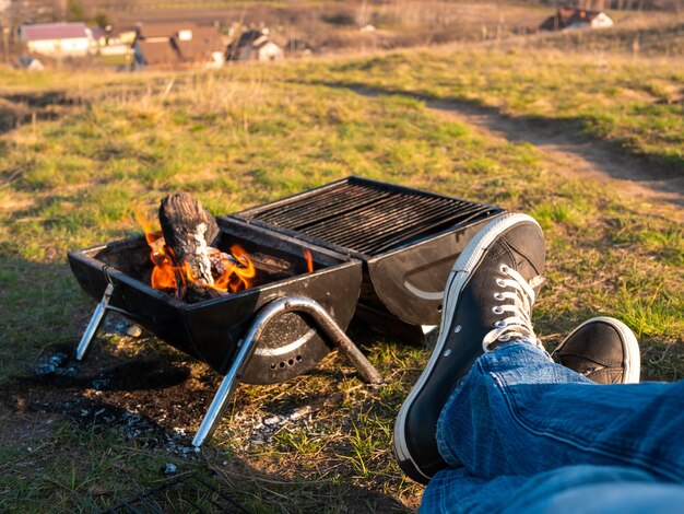 Having a good time barbecuing outdoors on a hike.