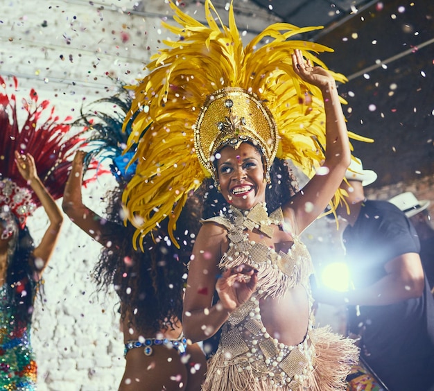 To having the time of our lives Cropped shot of beautiful samba dancers performing in a carnival with their band