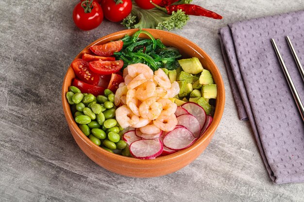 Hawaian cuisine Poke with cocktail shrimps and avocado