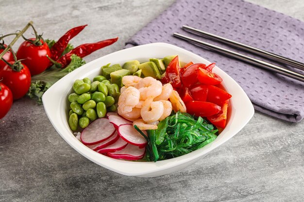 Hawaian cuisine Poke with cocktail shrimps and avocado