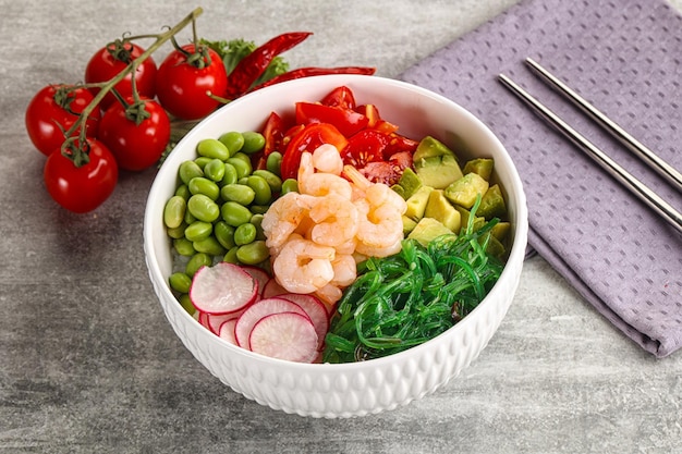 Hawaian cuisine Poke with cocktail shrimps and avocado