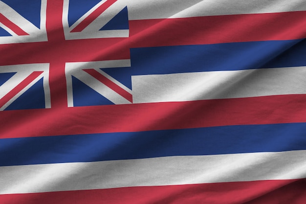 Hawaii US state flag with big folds waving close up under the studio light indoors The official symbols and colors in banner