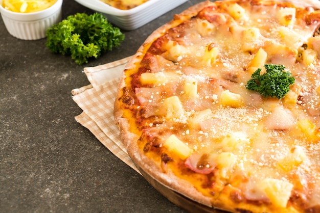 hawaiian pizza on table