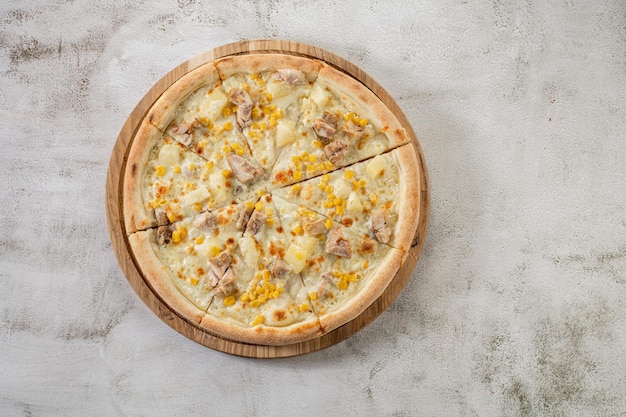 Hawaiian pizza with chicken meat pineapple and corn