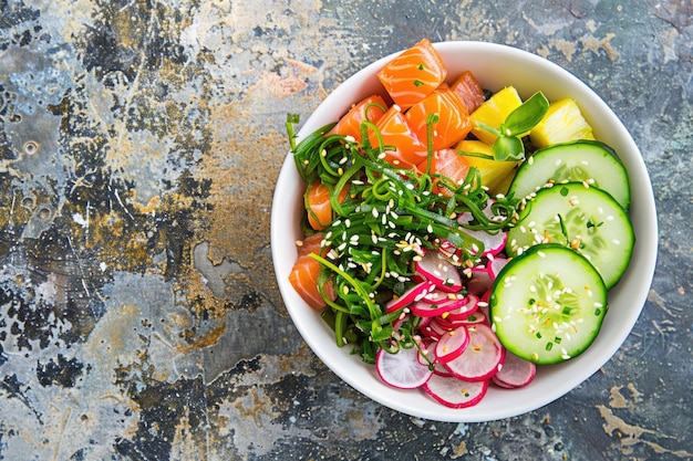 Hawaiian salmon poke bowl with fresh ingredients and copy space