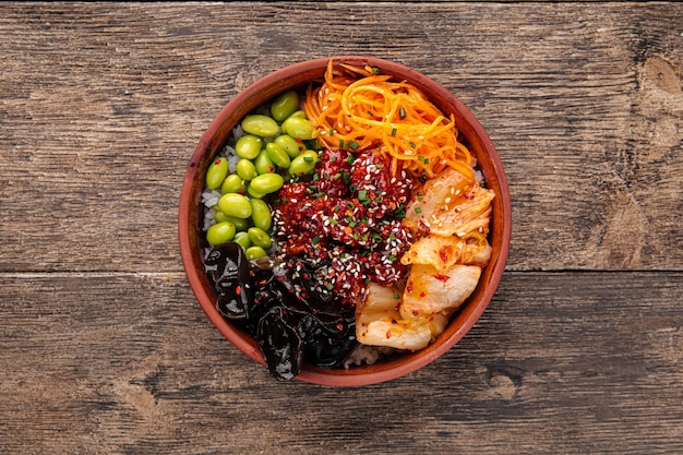 Hawaiian spicy chicken poke bowl with kimchi