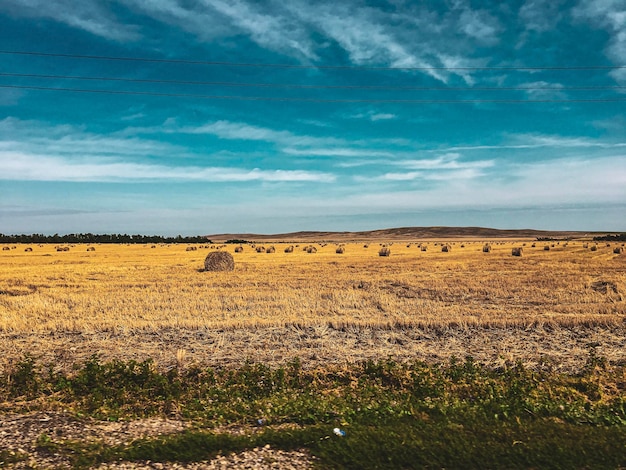 Photo hay bales on field against sky