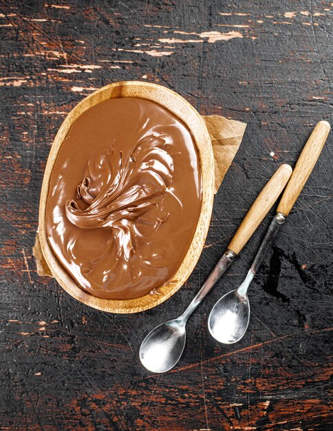 Hazelnut butter in a plate with a spoon