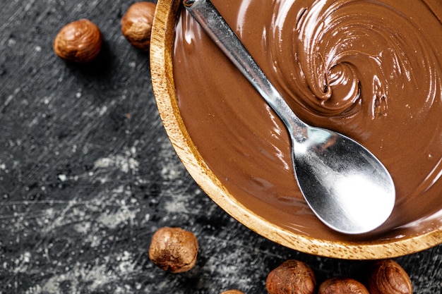 Hazelnut butter in a plate with a spoon