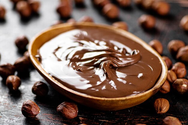 Hazelnut butter with peeled hazelnuts on the table