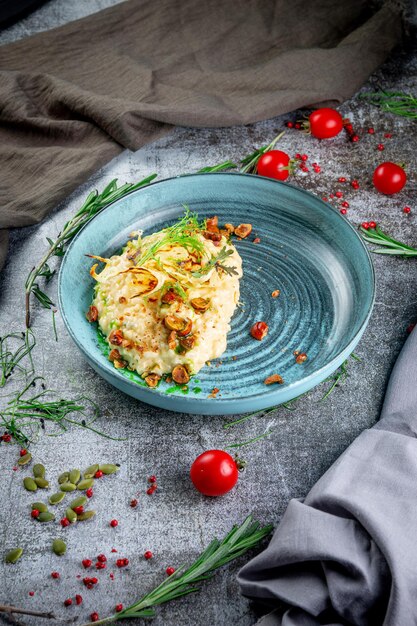 Hazelnut risotto on a gray stone table