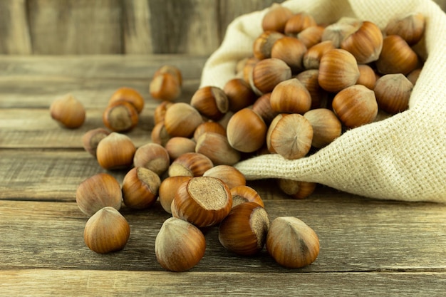 Hazelnut on a wood background with space for text