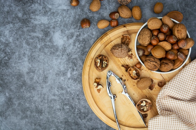 hazelnuts, almonds and walnuts in a basket.