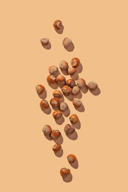 Hazelnuts on a beige background