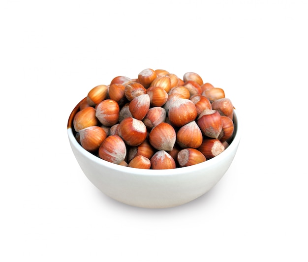 Hazelnuts in a bowl isolated