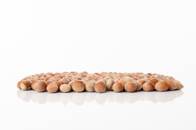 Hazelnuts nuts isolated on a white background with copy space.