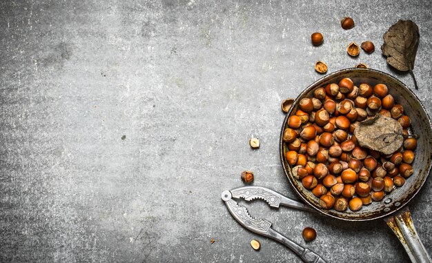 The hazelnuts in an old pan.