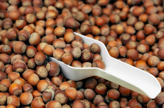 Hazelnuts in the supermarket with a scoop