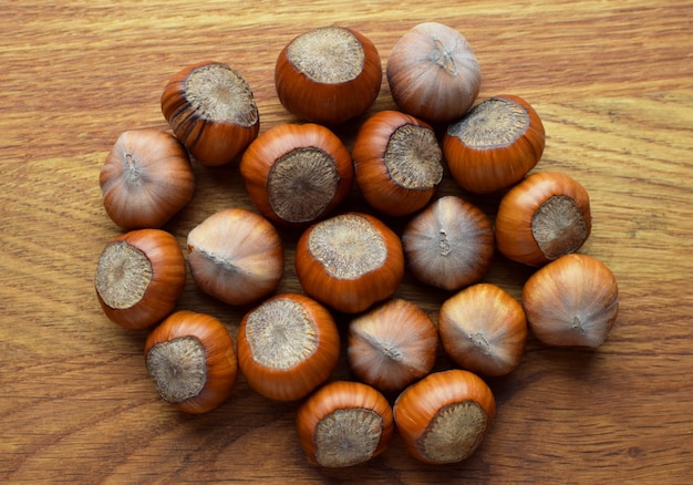 Hazelnuts on a wooden background. Hazelnuts in shell, healthy food