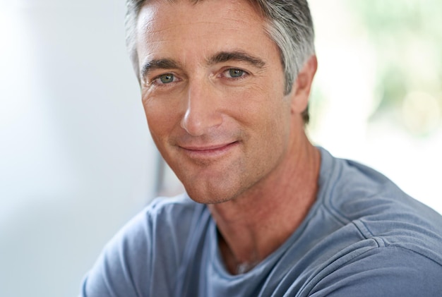 He exudes quiet confidence Cropped shot of a handsome mature man relaxing at home