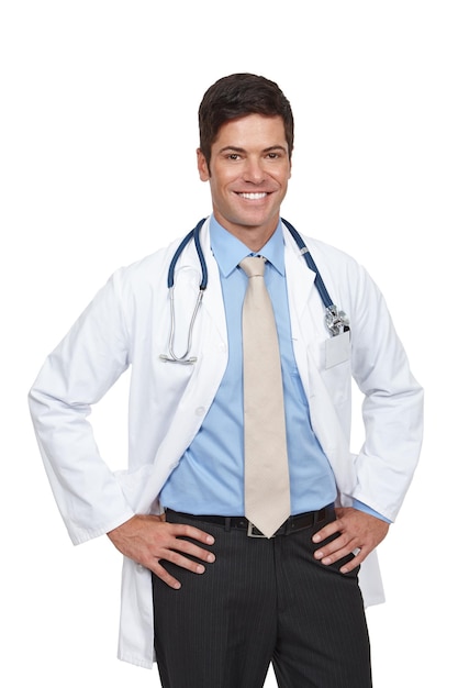 He has a great bedside manner Studio shot of a young doctor standing with his hands on his hips