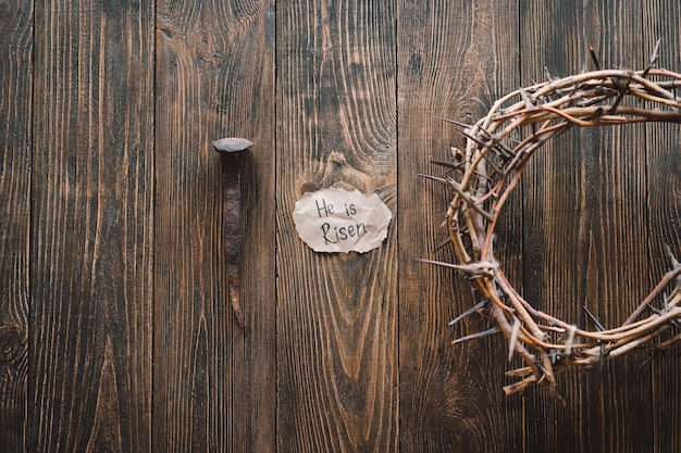 He is Risen Jesus Crown Thorns and nails and cross on a wood background Crucifixion Of Jesus Christ Passion Of Jesus Christ Concept for faith spirituality and religion Easter Day