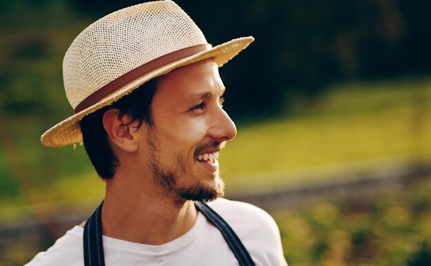 He sowed now watch him reap Shot of a handsome young man working in a garden